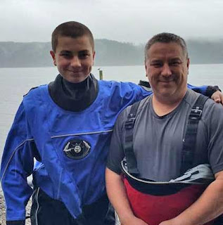 Joel and his dad after a drysuit dive in the Puget Sound