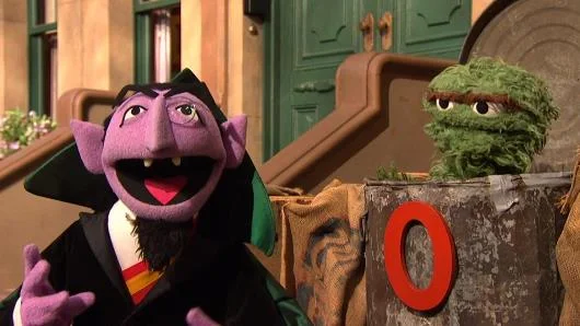 Sesame Street Episode 4512. Oscar the Grouch thinks the Count can't count the number of the day. Because the number of the day is 0.jpg