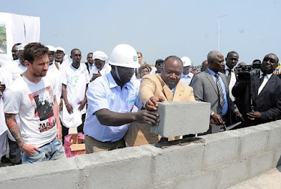 Messi lays brick at the Port-Gentil stadium,