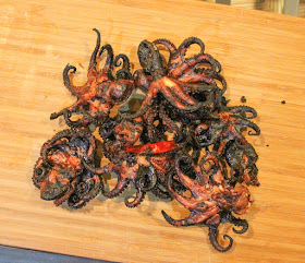 Food Lust People Love: Grilled Baby Octopus. Grilled baby octopus: The octopus is cooked until tender with garlic, hot chili peppers and red wine, then grilled to add smoky flavor and crunch. #SundaySupper