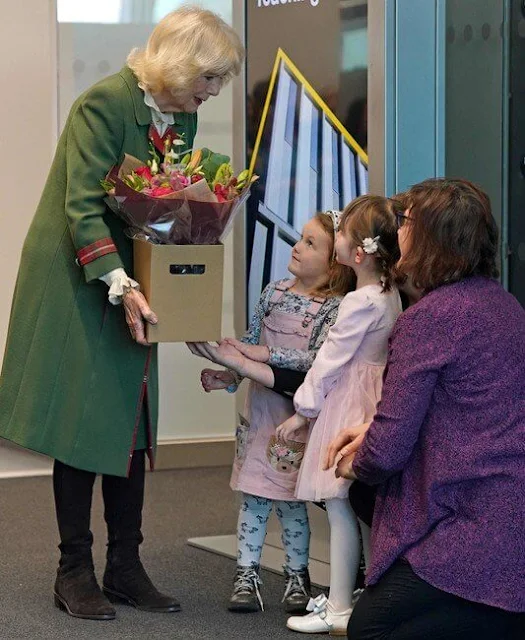 Camilla, Queen Consort wore a green wool coat and brown boots. Queen Camilla is the Chancellor of the University of Aberdeen