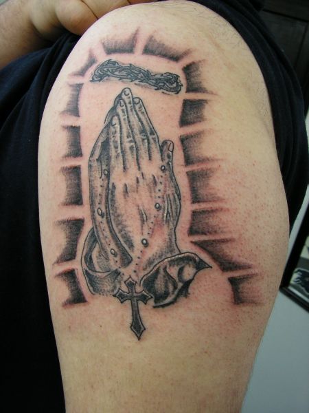 My first praying hands tattoo is this stunning tattoo with matching rosary 