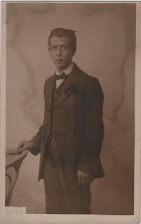 Vintage postcard of man posing for photograph