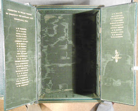 Opened doors within box revealing silk-lined interior