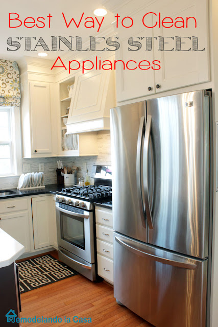 white kitchen with stainless steel appliances