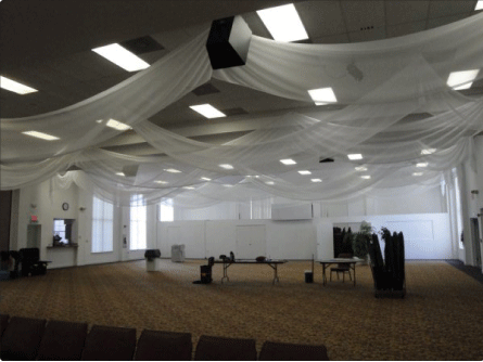 It was a very large and open space and our ceiling draping added just the