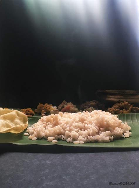 "Hot Kerala Matta rice served on a green banana leaf, capturing the authentic presentation and steaming aroma."