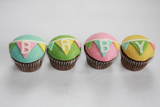 4 pastel baby bunting baby shower cupcakes