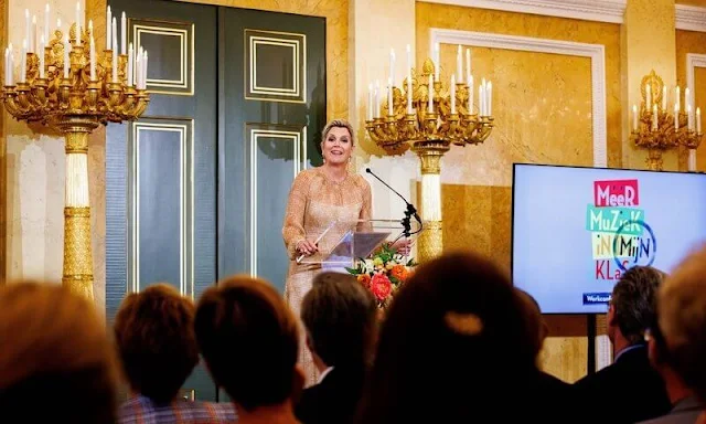 Queen Maxima opened the working conference titled More Music in the Classroom. Queen Maxima wore Natan dress