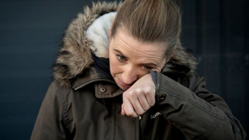 Danish Prime Minister "Mette Frederiksen" wipes her tears after being affected by the plight of the owners of mink farms.