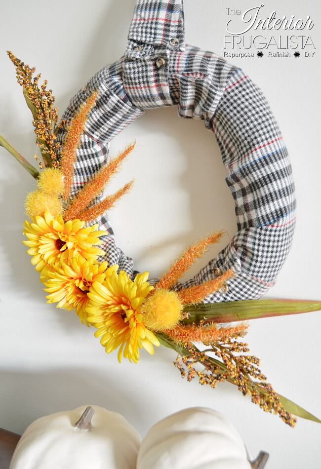 How to make an easy fall wreath with recycled flannel shirt sleeves and dollar store fall floral picks. Even the shirt collar is a wreath hanger!