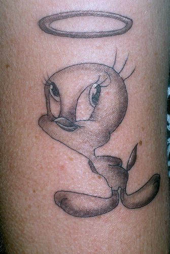 Lower back Tweety Bird Tattoo design with butterfly tattoo