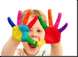 Happy child with painted hands