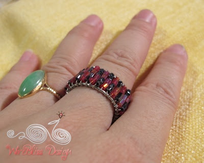 Wire wrapped seed beads adjustable ring on my finger