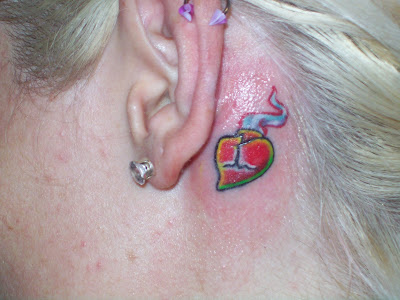 Sacred Heart Tattoo - small heart neck tattoo