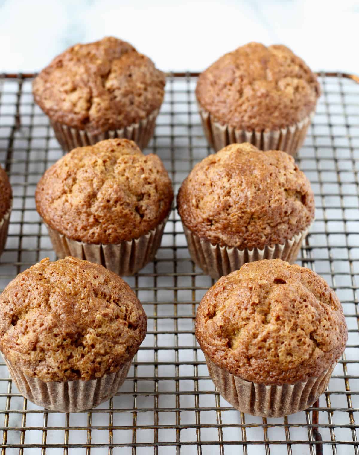 Churro Muffins on a cooling rack.