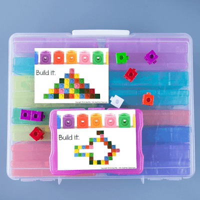 Photo of task cards and linking cubes on top of large bin of task card containers.