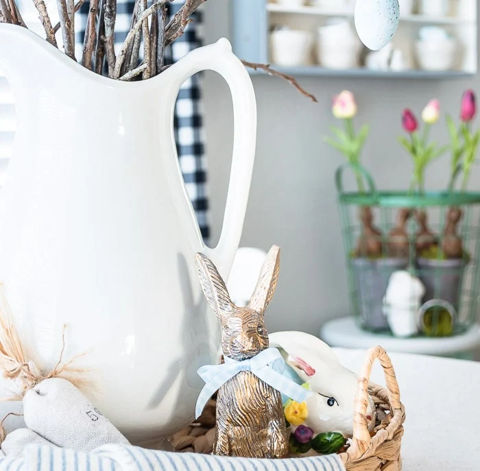 white pitcher, basket, bunnies and eggs