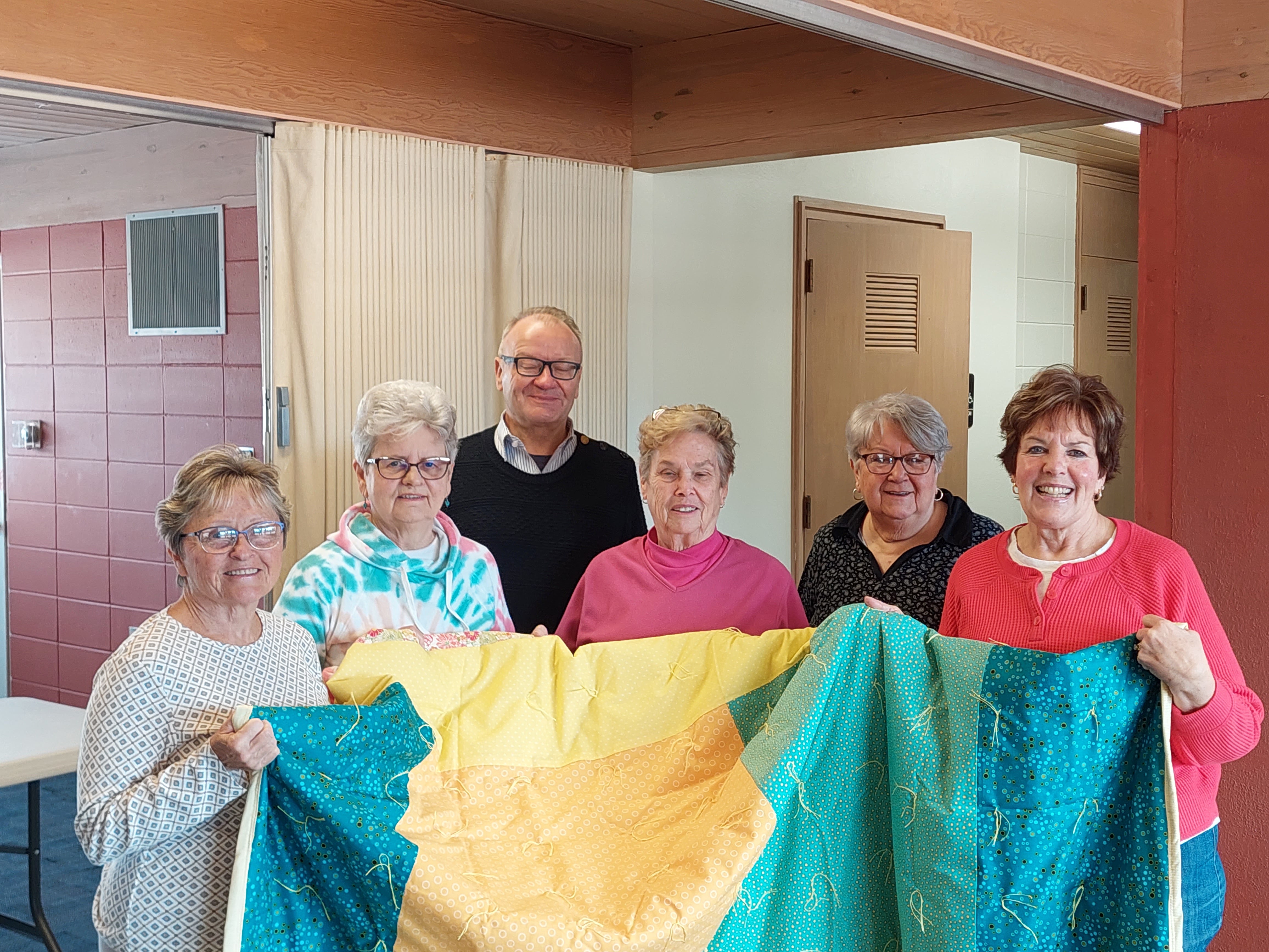 Dr. Gretebeck and the quilting team