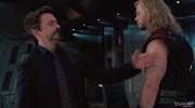 Tony Stark and Thor. Thor throwing his hammer (the avengers stills tony stark and thor)