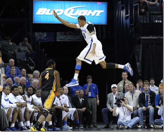 Feb 23, 2013; Memphis, TN, USA; Memphis Tigers forward D.J. Stephens (30) defends against Southern Mississippi Golden Eagles forward Dwayne Davis (4) at the FedEx Forum. Mandatory Credit: Nelson Chenault-USA TODAY Sports