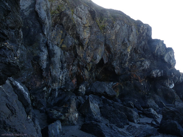 large yellow and red areas in the dark bluff rocks