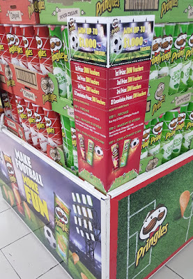 The full Pringles display includes the message "Make football more fun."