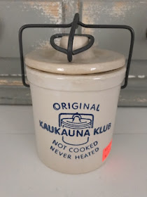 beige cheesecrock blue Kaukauna Klub logo