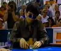Stu Ungar rechecks his cards... or card... or part of a card