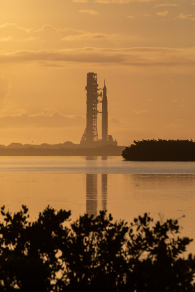 As the Sun rises, the mobile launcher carrying NASA's Space Launch System rocket continues its journey to Pad 39B at Kennedy Space Center in Florida...on June 6, 2022.