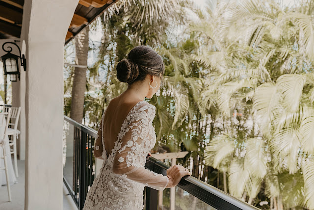 Bride looking down balcony The Manor on St Lucie Crescent Wedding captured by Stuart Wedding Photographer Heather Houghton Photography