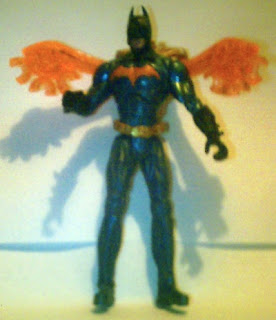 Unknown Batman action figure with orange light up back extensions