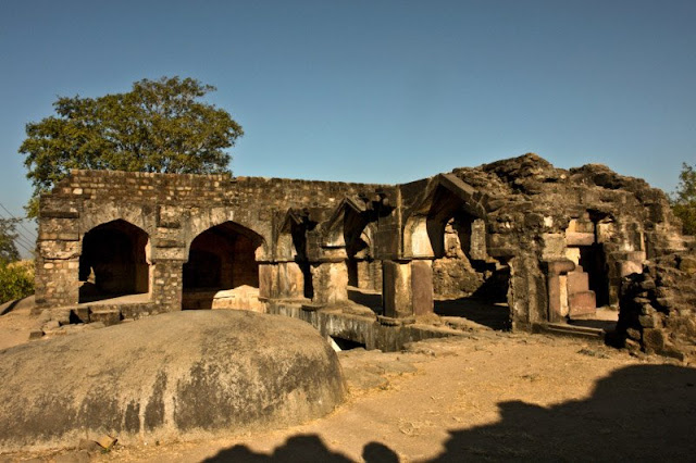   It has been 11 years since my trip to Jabalpur. And things may have changed quite a bit since then. May be the city is much more crowded. May be it is much more tourist friendly, with all the efforts of Madhya Pradesh Tourism. May be the historical monuments are much better maintained. May be it is much safer now. I will need to revisit the place to find out but till then, let me focus on how I remember the place. I think it is time for a time-turner post on Jabalpur.      The Time-Turner series is my opportunity to pen down the lingering memories and impressions of a place I have visited. It helps me relive the experience a bit and also reflect upon the aspects of the place that stood out the most to me. For more Time-Turner posts, follow this link: The Time-Turner Series.      The first thought that comes to my mind when I think of Jabalpur was that the city was hot even in winter, and that it was quite clean. I remember taking autos everywhere. They were easily available and the autowallahs were quite knowledgeable too.        Another lasting impression about Jabalpur is huge rocks that seemed to be everywhere we visited. At some places they were igneous rocks, at others they were metamorphic. In fact at many places, even historical monuments seemed to have been built so that these rocks fit right in. Very inclusive of the environment.      The prime example of this was Madan Mahal. Madan Mahal Fort was built around 11 A.D and was the pleasure palace for Madan Singh, the tenth Gond King and son of Rani Durgawati. During her reign, the fort was used as a watchtower. The fort has several interesting buildings and one can easily spend hours exploring this place. My only suggestion would be to go there in a group and when its light. Do not carry anything too expensive. The place is a little secluded and sometimes, anti-social elements hang out here.      The other interesting rock I saw was the balancing rock. This is one large igneous rock balancing itself precariously on another. The surface area of their connect is just a few square inches, and yet the rock has survived centuries and several strong earthquakes. If you are visiting Jabalpur, I would definitely recommend you visit this place as well. It is very close to Madan Mahal.       The next rocky place we saw was bhedaghat. This is a ravine where the river Narmada has been cutting through white marble rocks since ancient times. This is a beautiful place and I would recommend spending at least half a day here. You can take a boat ride that would refresh you and entertain you. The guide on the boat have a script that is pretty amusing.       Apart from these rocky places, Dhuandhar falls are another place that one must visit when you go to Jabalpur. The falls are massive and grand. And the sound, you need to hear it to believe it. The falls are very close to Bhedaghat and can be covered in the same trip.       Also worth visiting is the Chausanth Yogini temple, also enroute to Bhedaghat. It is an amazing place actually. If you are interested in photography, this place is for you. You will find some really interesting idols, beautiful architecture here. However, I do remember climbing countless stairs to get to the temple complex. I also remember that there was absolutely no one else here. A quiet and beautiful place. What more can you ask for?        Overall, my memories of Jabalpur are quite pleasant. I also remember meeting a distant relative of mine here. He belongs to Jabalpur. I don't know why but I have started relating to him much more ever since I visited his city back then in 2009.      Stay tuned for another Time-Turner post on Madhya Pradesh. Coming soon. 