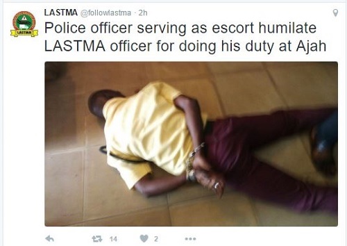 Oh No!!! See How Policeman Humiliated LASTMA Officer in Lagos State (Photos)