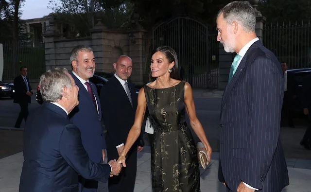 Queen Letizia wore a new embellished midi dress by Dries Van Noten. Carolina Herrera Jasmine gold earrings