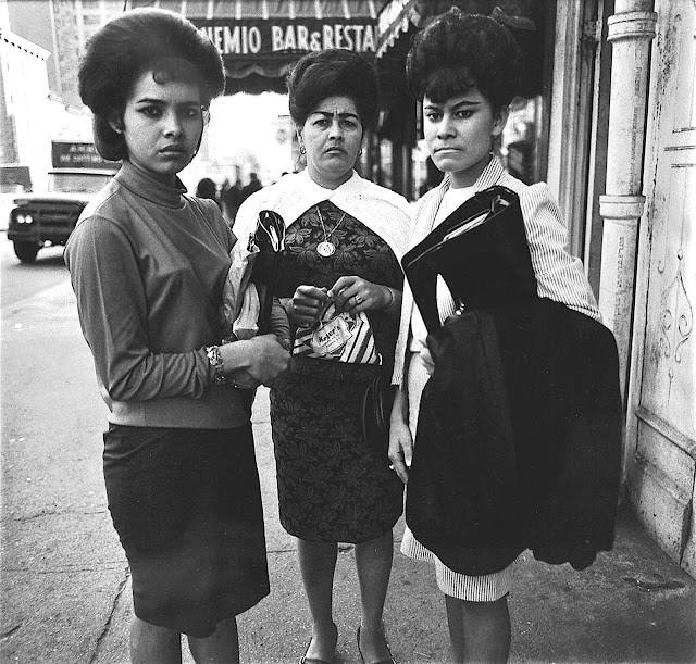 a Dianne Arbus photograph of three women interupted in the moment