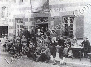 Gauguin sitting on the kerb, third from the right poses with fellow artists outside the Pension Gloanec, the favorite hotel for painters. 
