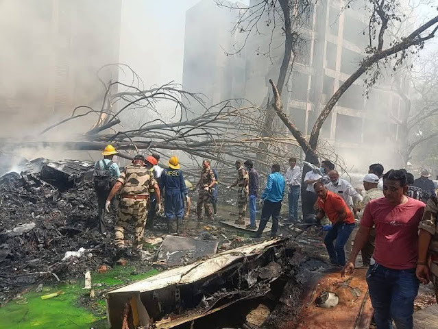 Rescue crews are extinguishing a fire in the wreckage of the plane.