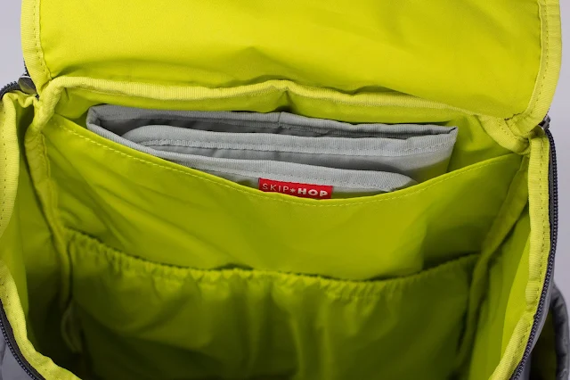 Close up view of main compartment showing the elasticated pockets and changing mat