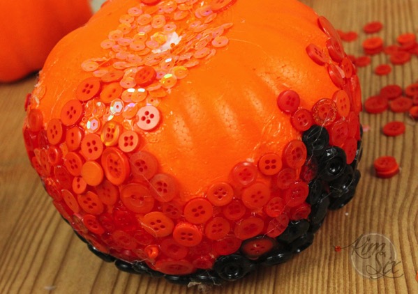 gluing-buttons-to-dollar-store-pumpkin.jpg Gluing buttons to dollar store pumpkin