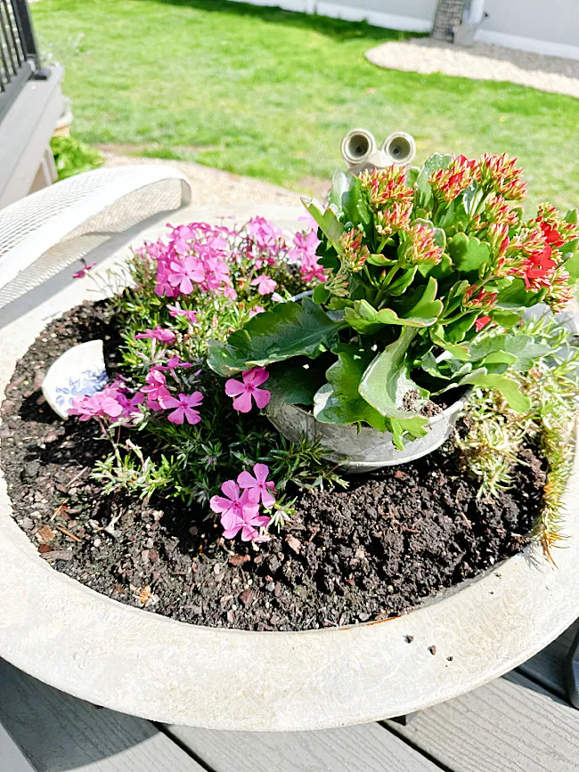 repurposed fire pit with flowers