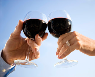 red wine glasses; toasting with wine; glasses
