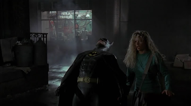 In the middle of fleeing the bad guys, Batman decides to do the limbo with a non-existent pole. He loses. 