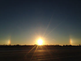 rainbow around the sun lights on both sides