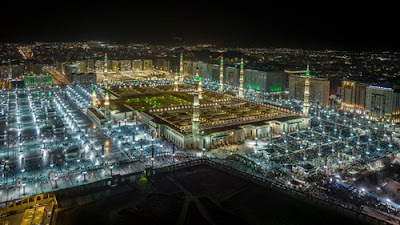 Aerial view of the Prophet's Mosque at night.