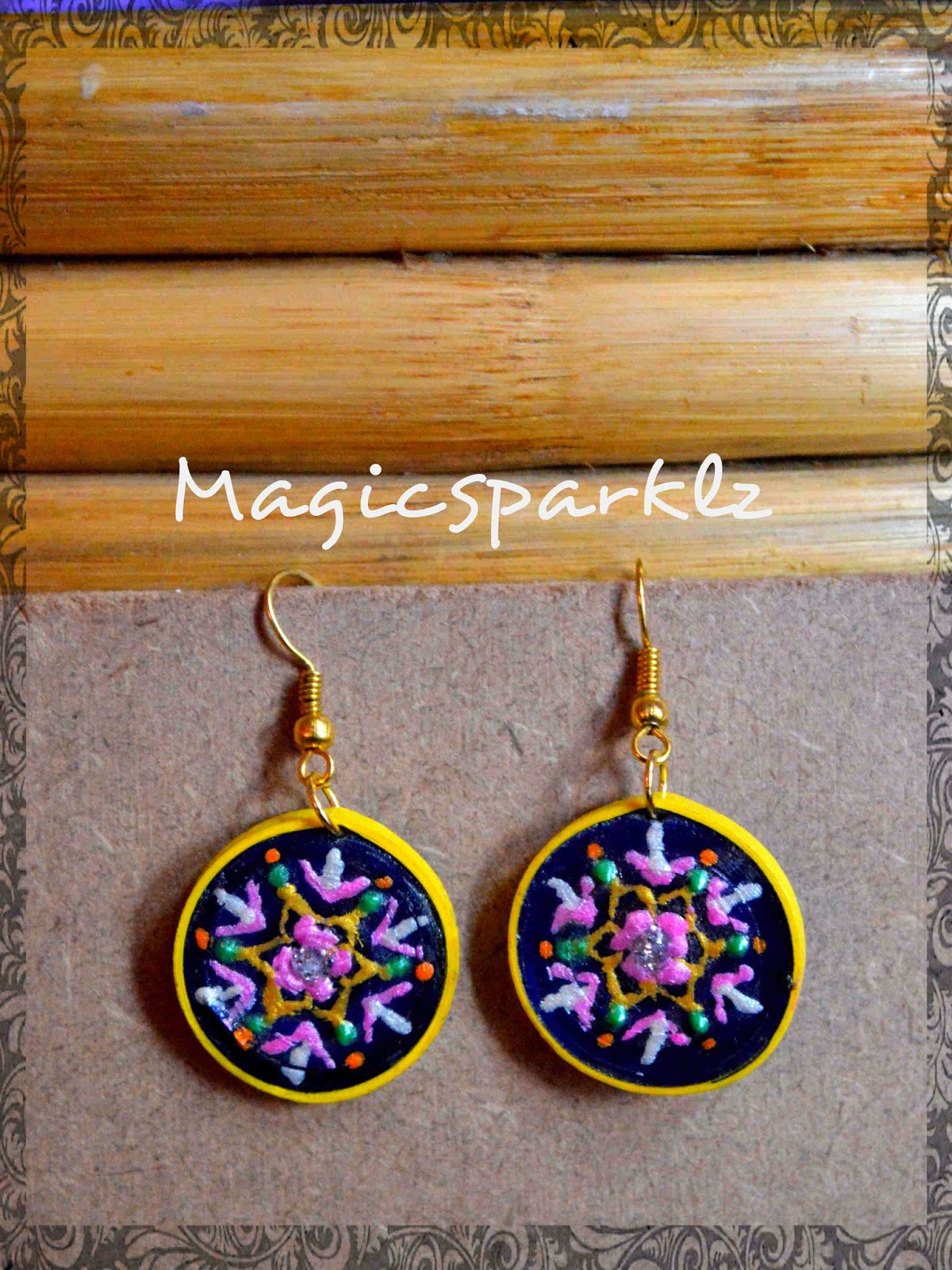 Elegantly pained quilled earrings