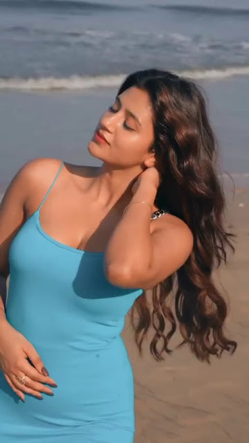 Glamorous Anjali Arora posing for the camera on the sandy beach