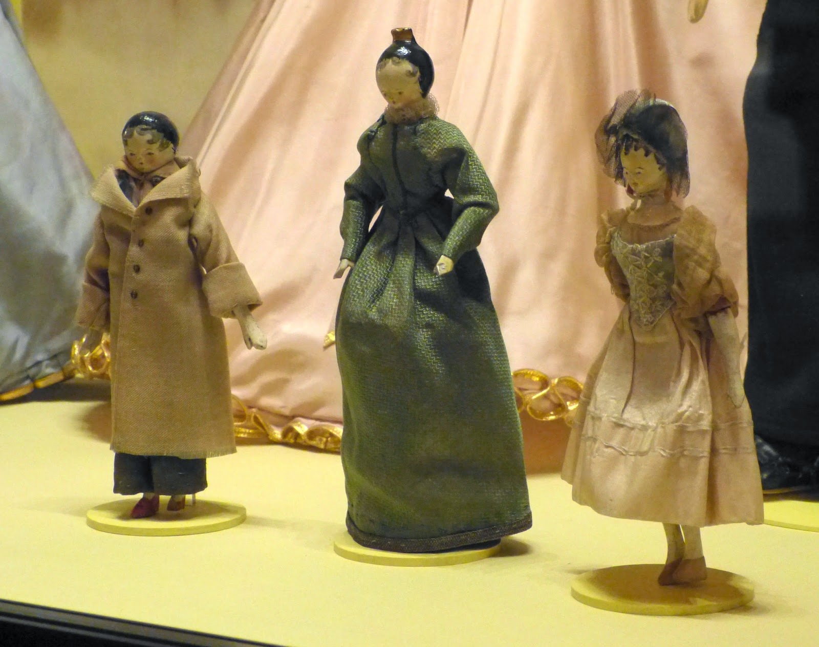 Home-made wooden dolls that belonged to the young  Queen Victoria at the Royal Childhood exhibition  at Buckingham Palace