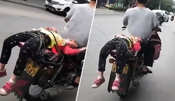 (Video) Netizen kecam bapa ikat anak tak nak pergi sekolah di belakang motosikal