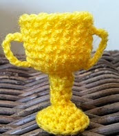 http://www.ravelry.com/patterns/library/tiny-cup-trophy